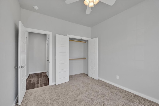 unfurnished bedroom with ceiling fan, a closet, and carpet