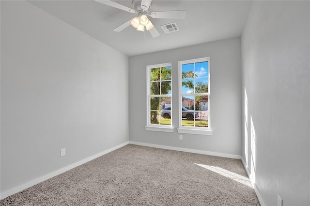 spare room with carpet and ceiling fan