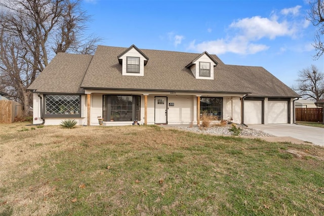 cape cod house featuring a front lawn