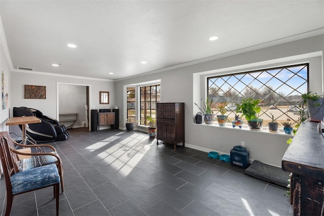 living area featuring crown molding