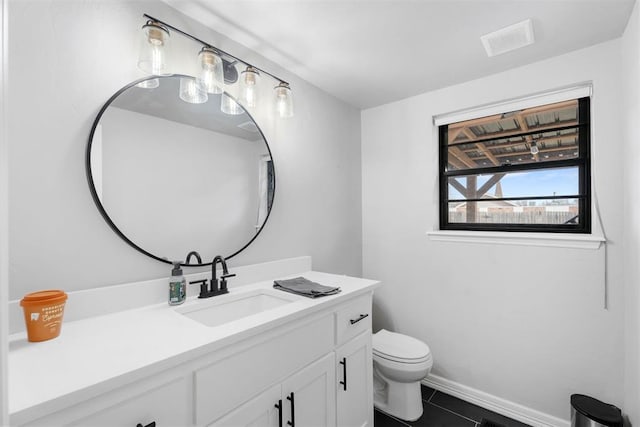 bathroom with tile patterned floors, vanity, and toilet