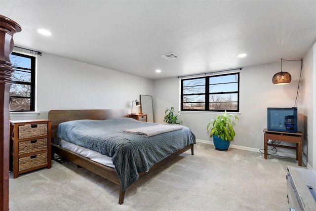 bedroom featuring light carpet