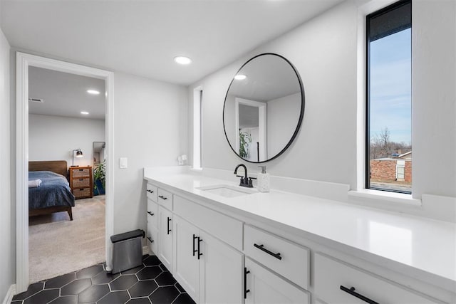 bathroom with tile patterned flooring and vanity