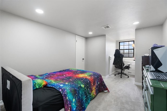 bedroom with light colored carpet