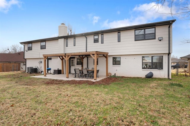 rear view of property featuring a yard, a patio, cooling unit, and a pergola