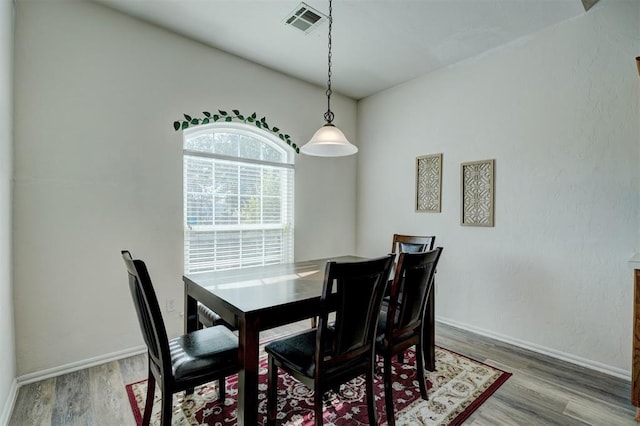 dining area featuring wood-type flooring