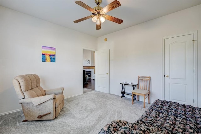 sitting room featuring carpet flooring and ceiling fan