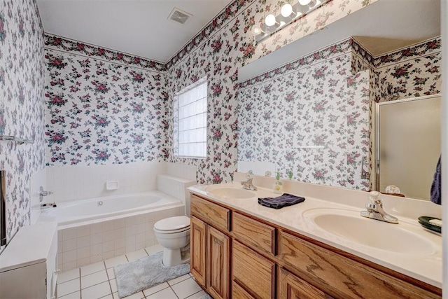 full bathroom with tile patterned flooring, shower with separate bathtub, vanity, and toilet