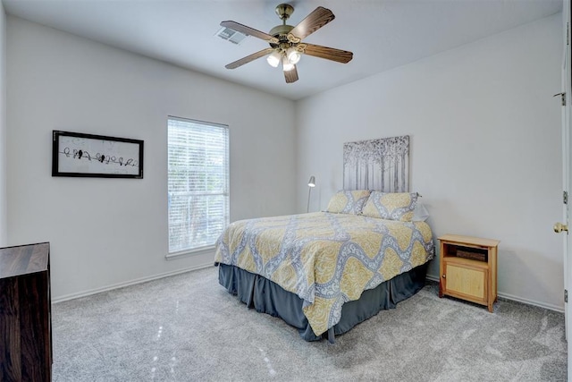 bedroom featuring ceiling fan and light colored carpet