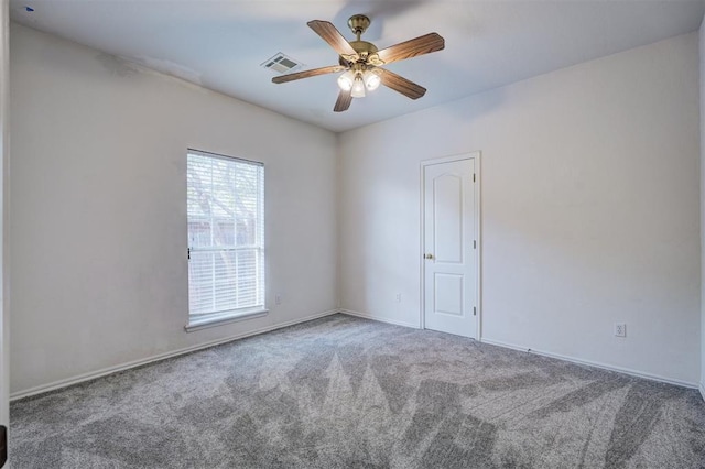 carpeted empty room featuring ceiling fan