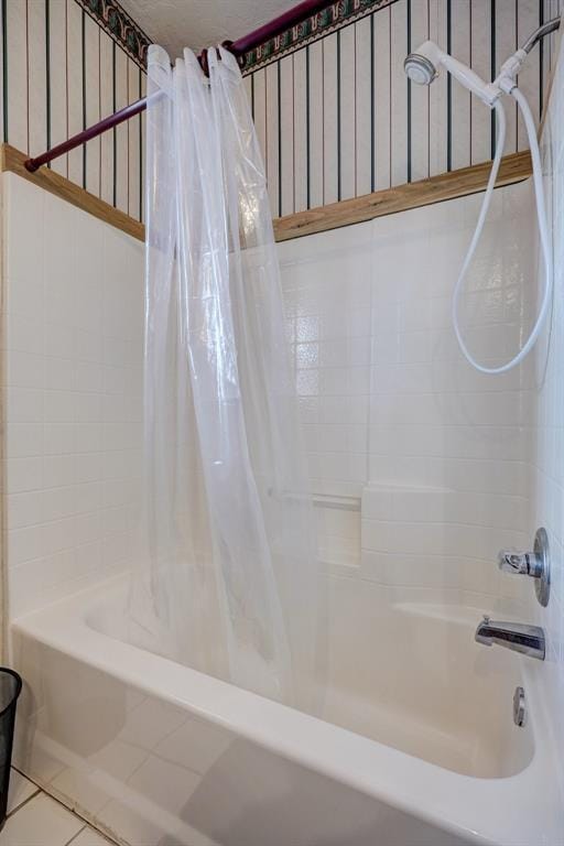 bathroom featuring tile patterned floors and shower / bath combination with curtain