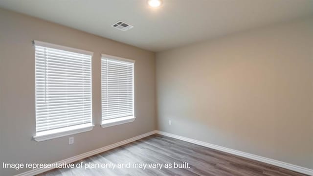 13581 Hickory Way, Edmond, OK 73025 - spare room featuring wood finished floors and baseboards
