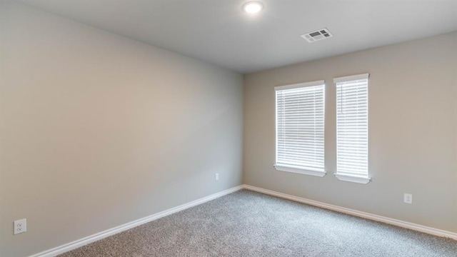 13581 Hickory Way, Edmond, OK 73025 - carpeted spare room with baseboards and healthy amount of natural light