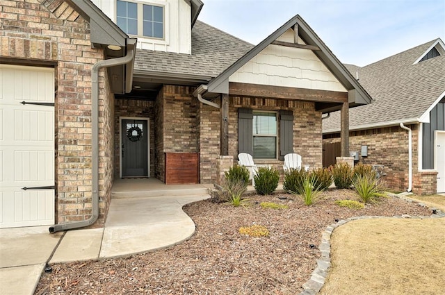 doorway to property featuring a porch and a garage