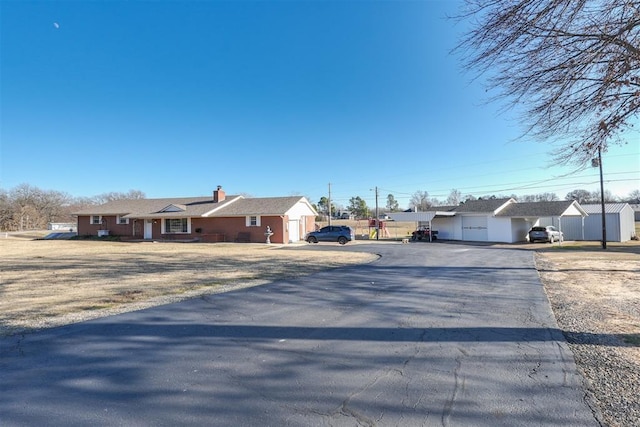 ranch-style house featuring a garage