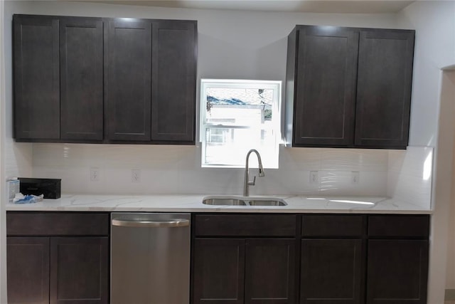 kitchen with decorative backsplash, dishwasher, light stone counters, and sink