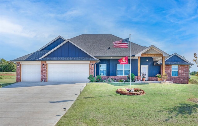 view of front of property featuring driveway, an attached garage, a shingled roof, and a front yard