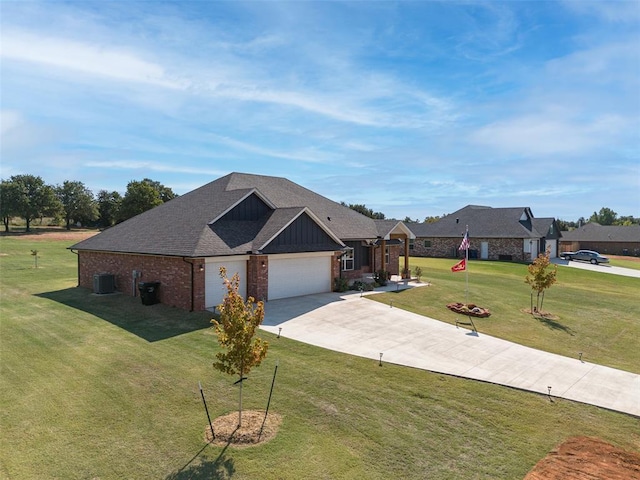 view of front of house featuring a garage, central air condition unit, a front lawn, board and batten siding, and brick siding