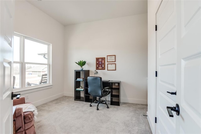 home office with baseboards and carpet flooring