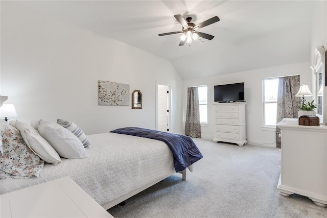 bedroom with light carpet, lofted ceiling, and a ceiling fan