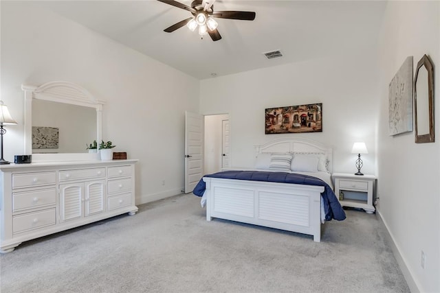 bedroom featuring light carpet, baseboards, visible vents, and ceiling fan