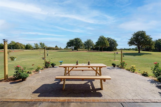 view of home's community with a patio area and a lawn