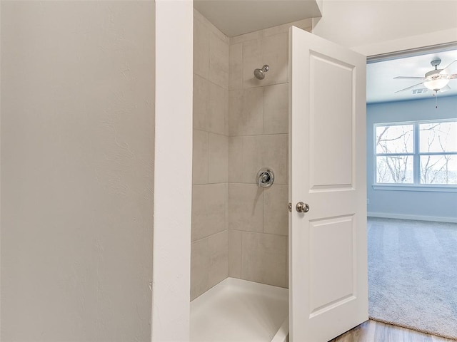 13074 Mannington Rd, Edmond, OK 73025 - bathroom with tiled shower and a ceiling fan