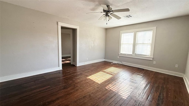 unfurnished room featuring a textured ceiling, ceiling fan, and dark wood-type flooring