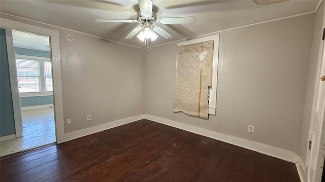 spare room featuring ceiling fan and dark hardwood / wood-style floors