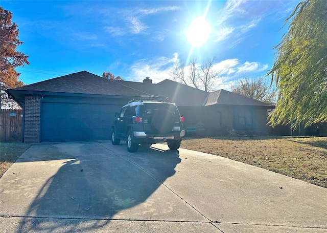 view of property exterior featuring a yard and a garage