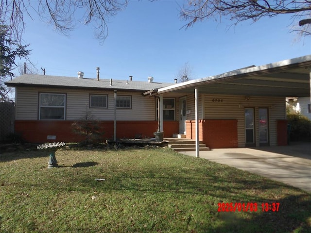 ranch-style house with a carport and a front lawn