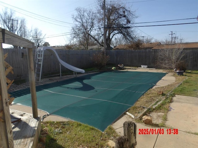 view of swimming pool featuring a water slide