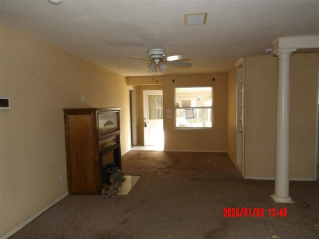 unfurnished living room with decorative columns and ceiling fan