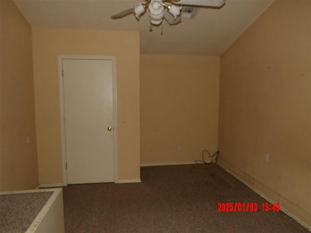 empty room with ceiling fan and carpet floors