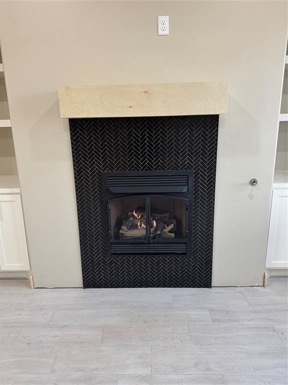 interior details with a tiled fireplace