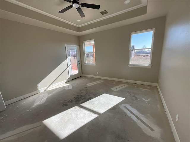 unfurnished room with crown molding, ceiling fan, and a tray ceiling