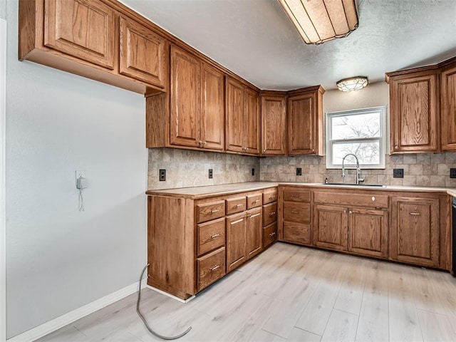 kitchen featuring backsplash and sink