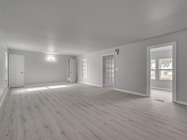 spare room featuring light hardwood / wood-style floors