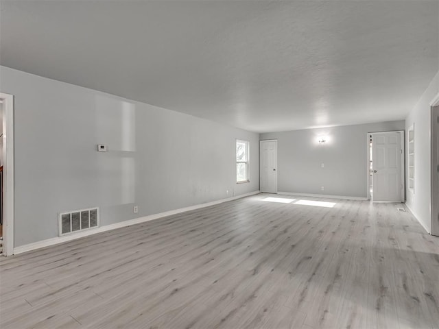 spare room featuring light hardwood / wood-style flooring