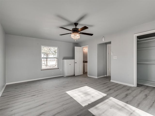 unfurnished bedroom with ceiling fan and light hardwood / wood-style flooring