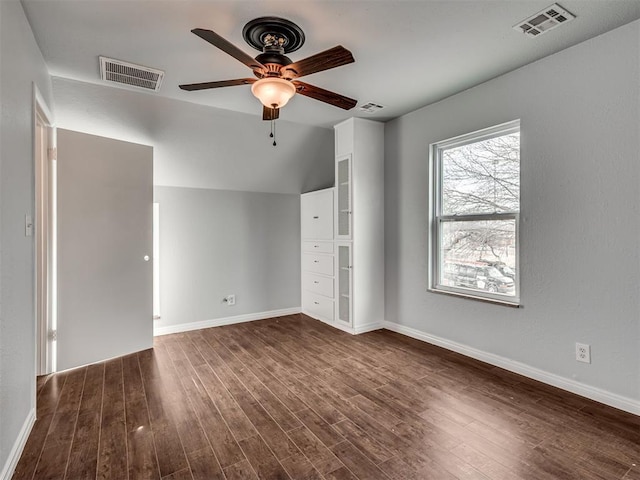 unfurnished bedroom featuring ceiling fan, dark wood-type flooring, and vaulted ceiling