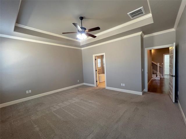 4309 NW 152nd Pl, Edmond, OK 73013 - unfurnished bedroom featuring visible vents, baseboards, ornamental molding, a raised ceiling, and carpet floors