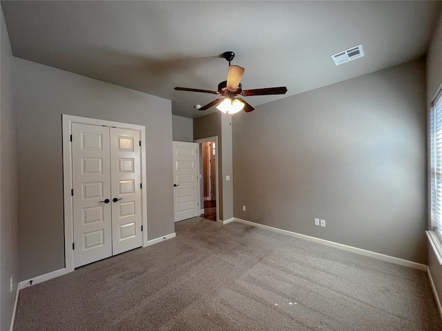 4309 NW 152nd Pl, Edmond, OK 73013 - unfurnished bedroom with a closet, visible vents, carpet, baseboards, and ceiling fan