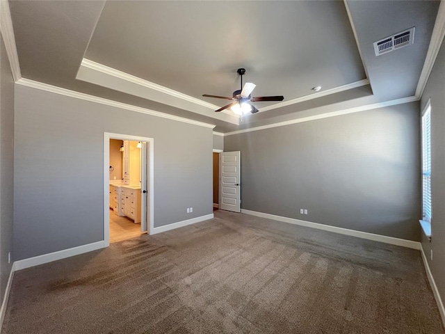 4309 NW 152nd Pl, Edmond, OK 73013 - unfurnished bedroom featuring baseboards, a tray ceiling, visible vents, and carpet