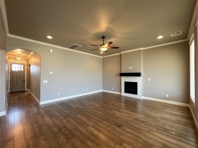 4309 NW 152nd Pl, Edmond, OK 73013 - unfurnished living room with arched walkways, dark wood-type flooring, ceiling fan, and visible vents