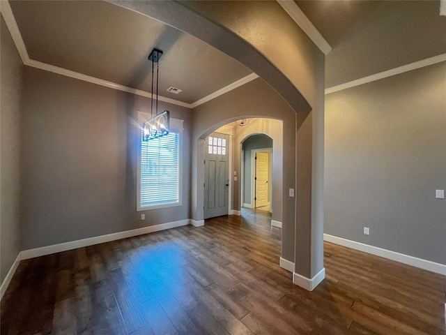 4309 NW 152nd Pl, Edmond, OK 73013 - entrance foyer featuring dark wood-style floors, arched walkways, baseboards, and ornamental molding