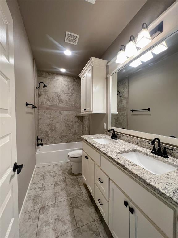 4309 NW 152nd Pl, Edmond, OK 73013 - bathroom with visible vents, a sink, toilet, and bathtub / shower combination
