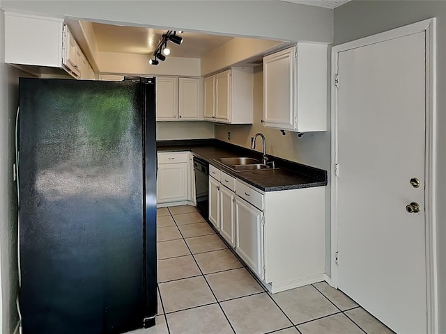 kitchen featuring light tile patterned floors, sink, white cabinetry, and black appliances