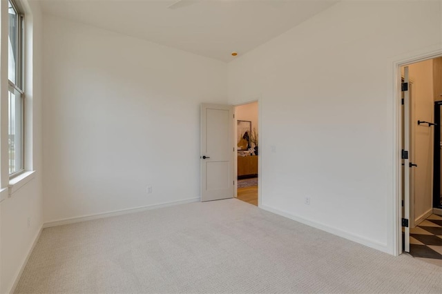 spare room with light colored carpet