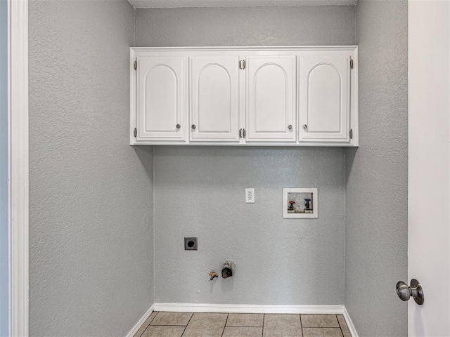 laundry room with electric dryer hookup, cabinets, gas dryer hookup, hookup for a washing machine, and light tile patterned floors